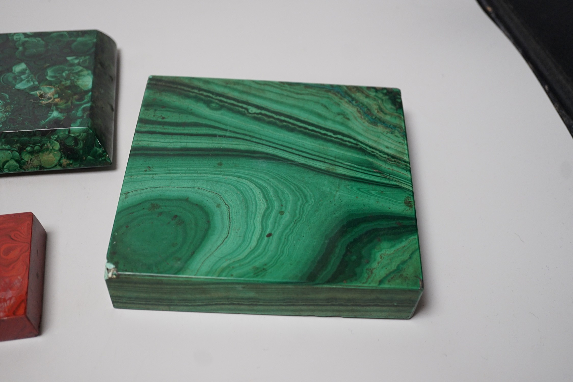 A group of malachite and other hardstone plinths and a small casket